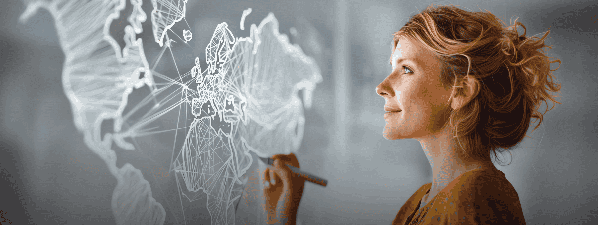 Una donna traccia con una penna una mappa virtuale del mondo