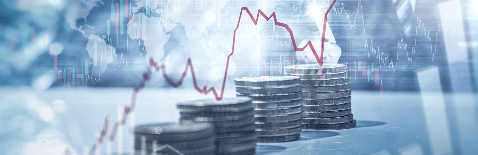 grafico appoggiato sopra delle pile di monete