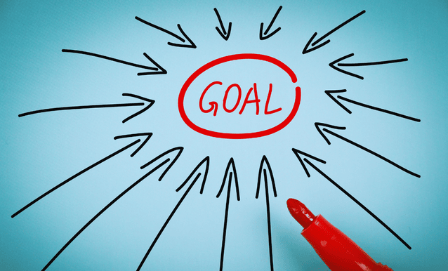 Parola "Obiettivo" evidenziato con frecce e pennarello rosso su uno sfondo blu.