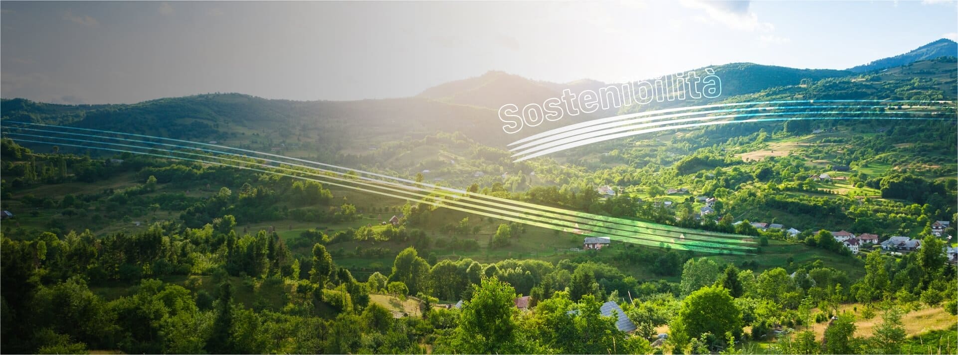 Poche abitazioni immerse nel verde con il sole che illumina la vallata. “Sostenibilità”